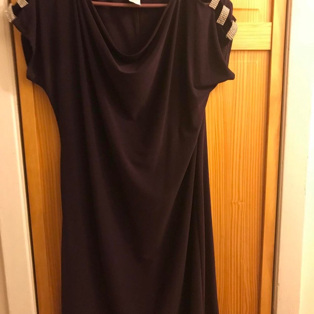 Ladies plum colored dress with shoulder embelishments.